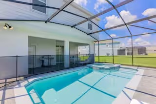Screened pool and spa at a Davenport vacation home